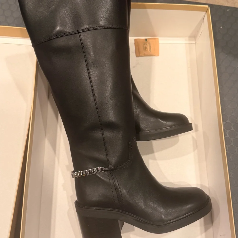MICHAEL Kors Carlisle knee-high boots in black leather with a chain detail heel